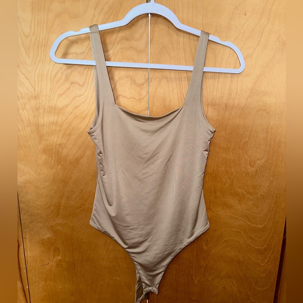 Tan body suit